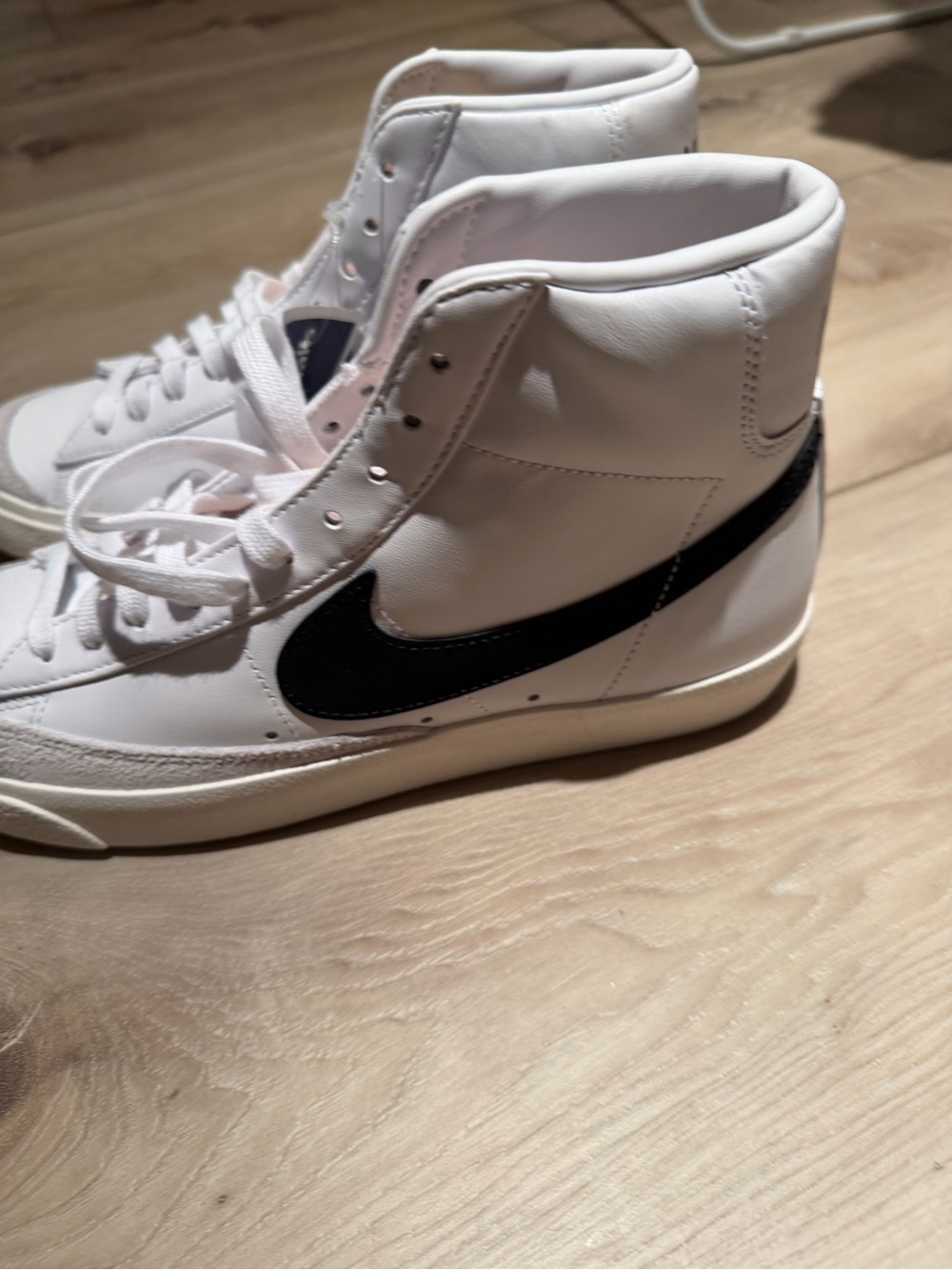 Nike Women’s White High-Top Sneakers with Black Swoosh Accent